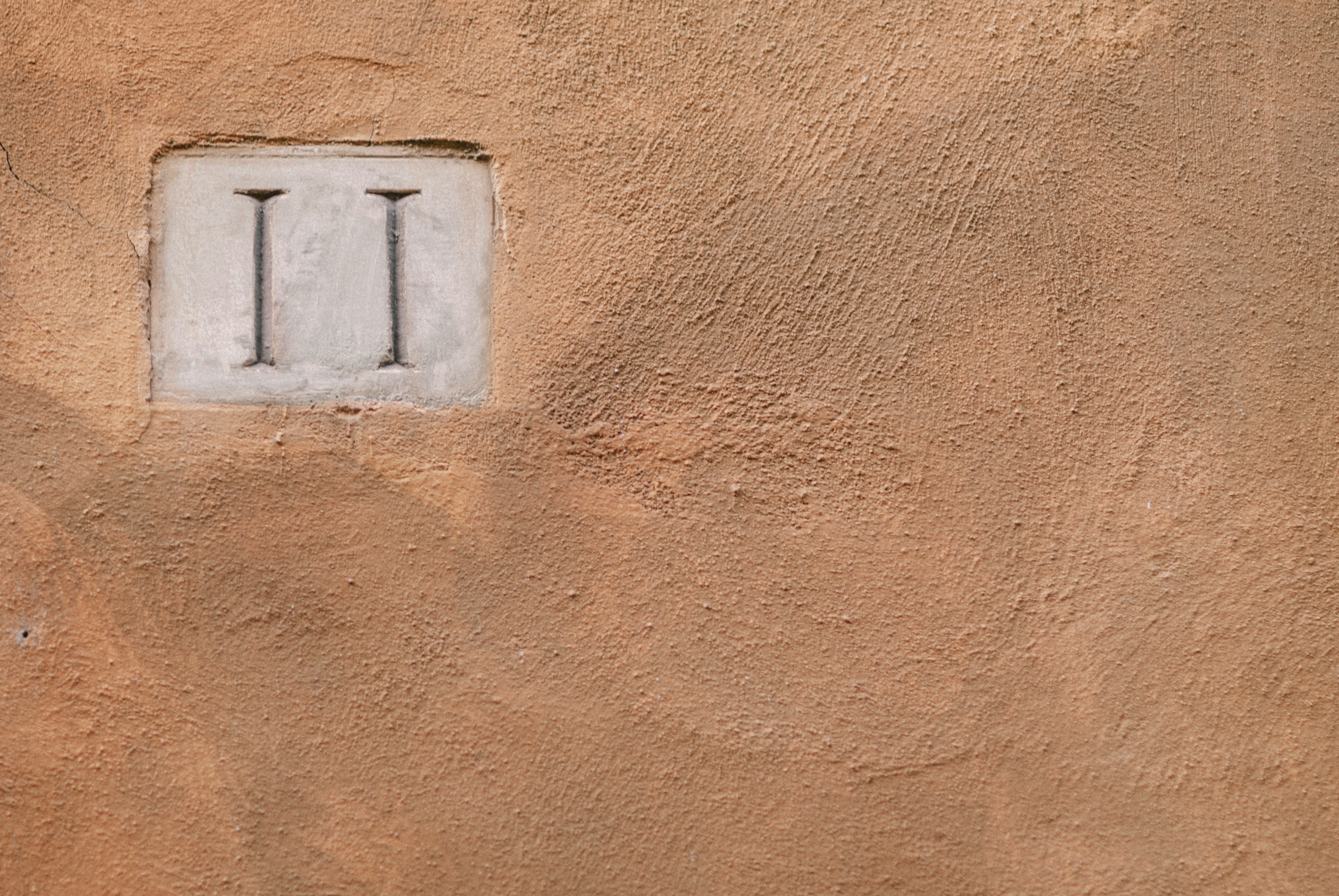 white light switch on brown wall